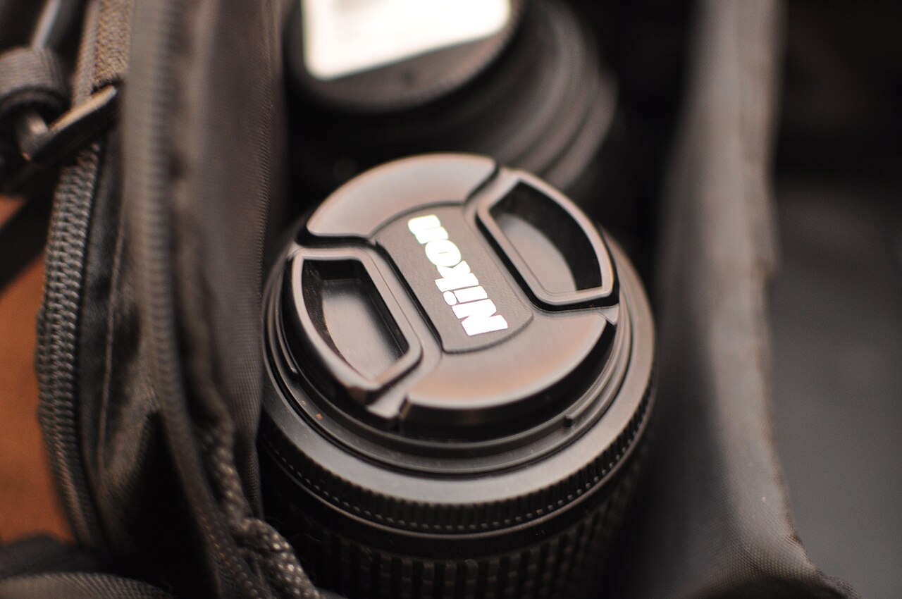 Camera lens packed in a padded equipment bag